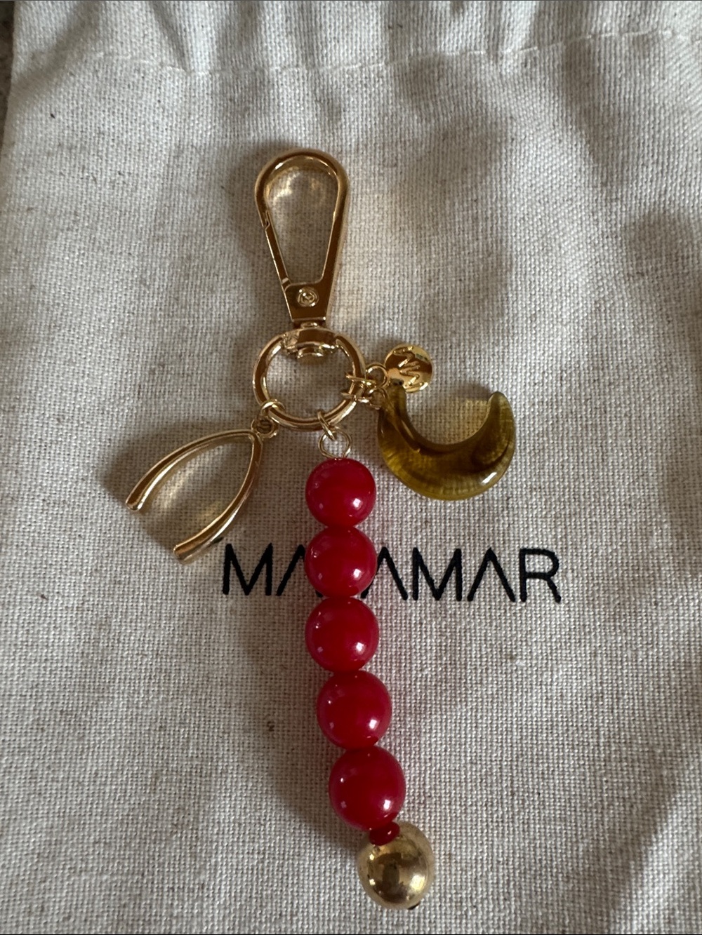 Gold-Tone Keychain with Red Beads and Amber Crescent Charm